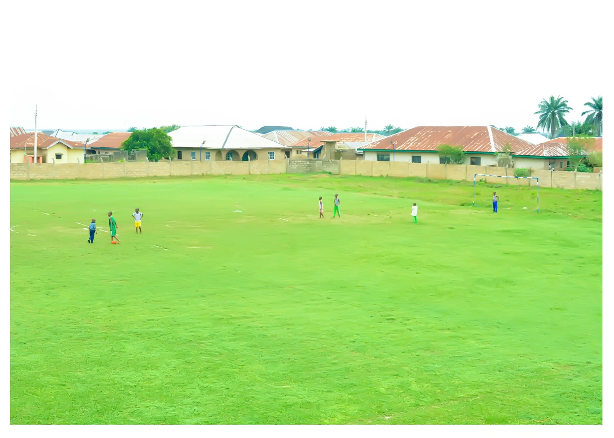 Inaayatullah learners playing football across the Academy field