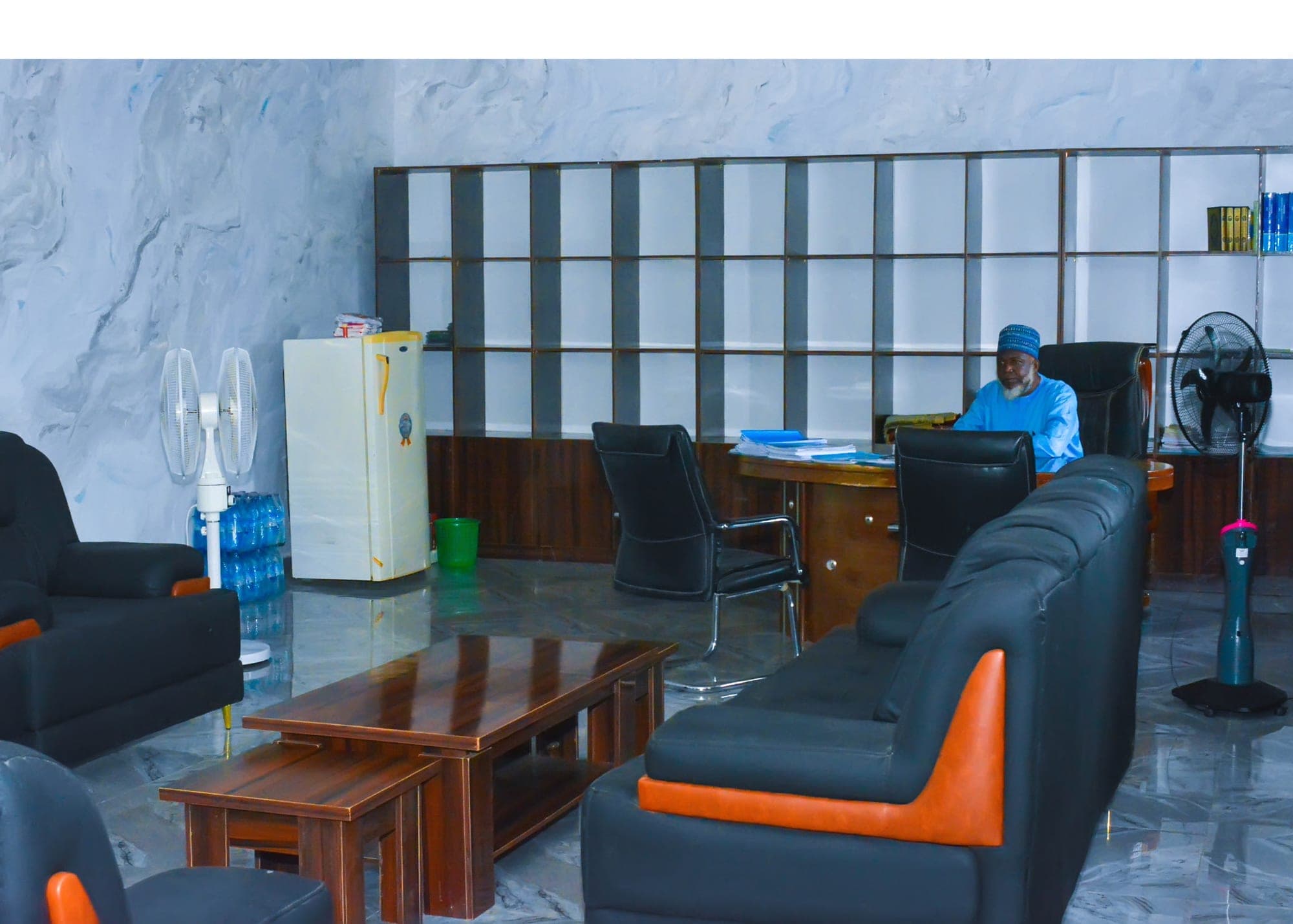 The administration office with sofas, a desk and shelving